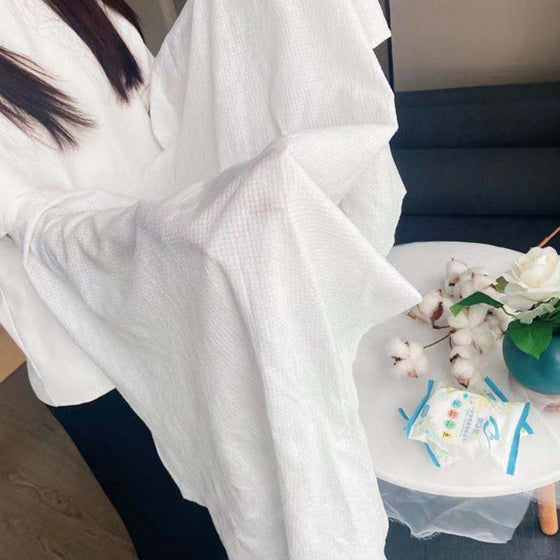 Einweg-Badetuch aus komprimierter Baumwolle