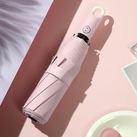 Dreifach selbstöffnender und zurückziehbarer Regenschirm mit Schnalle